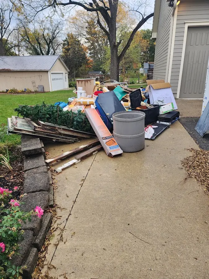Dumpster being loaded with debris for Commercial Dumpster Rental in Cresco